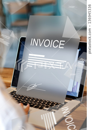 Banking invoice payment process on a laptop during daytime at a workspace 136945336