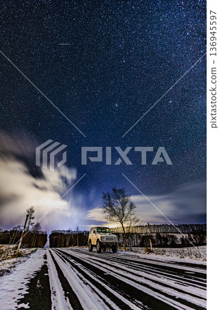 A winter starry sky landscape created by shooting stars and cars A winter starry sky landscape created by shooting stars and cars 136945597