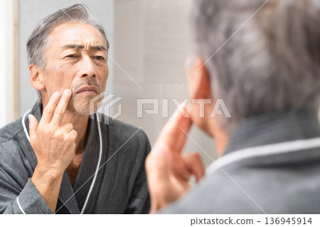 Senior man doing skin care Beauty image Senior man doing skin care Beauty image 136945914