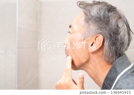 Senior man doing skin care Beauty image Senior man doing skin care Beauty image 136945915