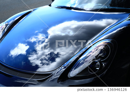 The bonnet of a shiny sports car 136946126