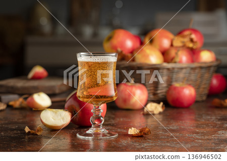 Apple cider on an old kitchen table. Apple cider on an old kitchen table. 136946502