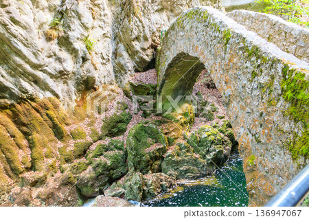 Old small stone bridge over river at Gorges de l'Areuse, Switzerland Old small stone bridge over river at Gorges de l'Areuse, Switzerland 136947067