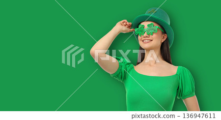 A woman in green is enjoying St. Patrick's Day 136947611