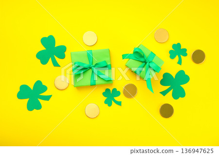 Green gifts with ribbons, shamrocks, and gold coins Green gifts with ribbons, shamrocks, and gold coins 136947625