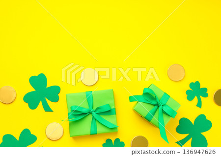 Green gifts with ribbons, shamrocks, and gold coins Green gifts with ribbons, shamrocks, and gold coins 136947626