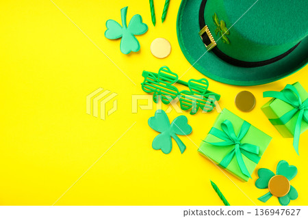 Bright yellow background with green St. Patrick's Day decorations Bright yellow background with green St. Patrick's Day decorations 136947627