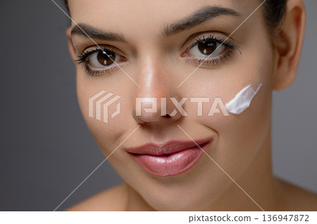 Face Skin care. Woman with healthy smooth facial clean skin .Beauty face care.Facial treatment.Cosmetology.Beauty and Spa.. 136947872