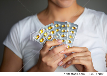 Woman With Birth Control Pills. Beautiful Smiling Girl Holding Blister Pack With Oral Contraceptive Pills Woman With Birth Control Pills. Beautiful Smiling Girl Holding Blister Pack With Oral Contraceptive Pills 136947885