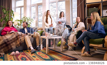 Creative team meeting in bright loft office with natural light. 136948026