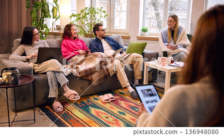 Smiling colleagues brainstorming together in cozy modern office. 136948080