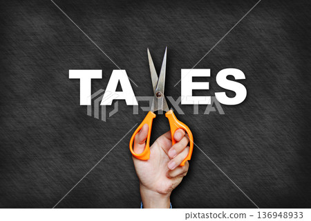 The man's hand holding scissors forms the letter x, creating the word "taxes". The man's hand holding scissors forms the letter x, creating the word "taxes". 136948933