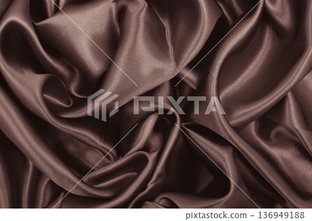 Smooth elegant brown silk or satin texture as abstract background. Luxurious background design. Sepia toned. Retro style 136949188
