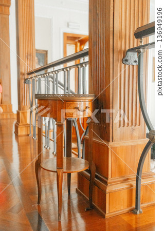 Interior space with polished wood floor and vintage furniture. Concept of luxury design and classic European style. Interior space with polished wood floor and vintage furniture. Concept of luxury design and classic European style. 136949196