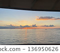 Sunset on the horizon seen from a cruise ship 136950626