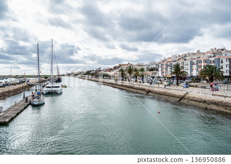 People walking through the Marina of the city of Lagos in Portug People walking through the Marina of the city of Lagos in Portug 136950886
