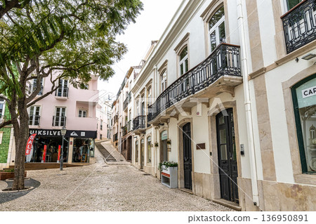 Lagos, Portugal - Feb 22, 2026: Colorful houses in the Praca Luis de Camoes in Lagos, Algarve, Portugal 136950891