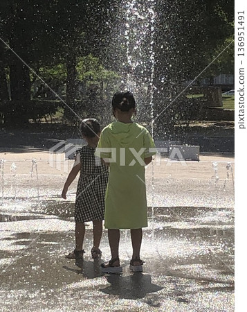 Children playing with fountains 136951491