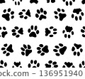 Black silhouettes of prints of dog paws, Seamless pattern	 136951940