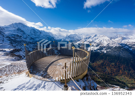 Spectacular panoramic view of the Alps from the crown-shaped observation deck on the summit of Männlichen, Grindelwald, canton of Bern, Switzerland Spectacular panoramic view of the Alps from the crown-shaped observation deck on the summit of Männlichen, Grindelwald, canton of Bern, Switzerland 136952343