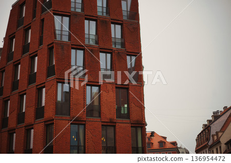 Modern Red Brick Residential Building with Balconies in European City Modern Red Brick Residential Building with Balconies in European City 136954472