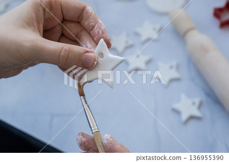 Christmas star Master class of painting Children air dry clay activity handicraft idea. DIY process step by step instruction. Preparing for Christmas tree holiday decorating. Modern organic design 136955390
