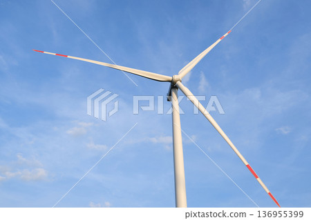 Wind Turbines on Hilltop Against Blue Sky Wind Turbines on Hilltop Against Blue Sky 136955399