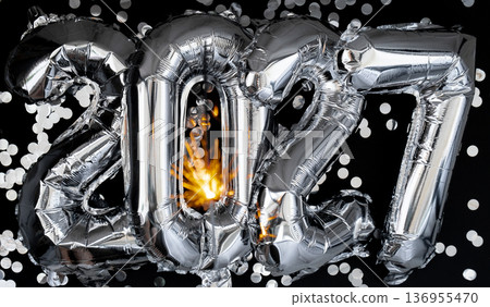 Happy new year 2027 metallic balloons with confetti and sparkler firework Bengal lights on dark black background. Greeting card silver foil balloons numbers Christmas holiday concept. Celebration 136955470