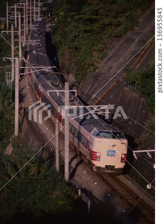 The 381 series Kuroshio limited express train bathed in the setting sun, 1985, Kisei Main Line, Hiyamizuura. 136955845