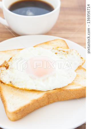 A delicious morning of fried egg toast and coffee 136956714