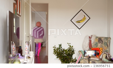 Casual scene of woman leaving apartment in purple attire Casual scene of woman leaving apartment in purple attire 136956731