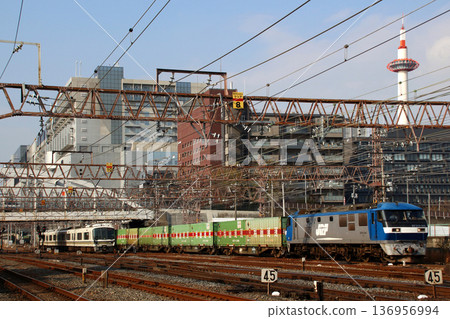 A freight train (EF210 No. 901) passing in front of Kyoto Station 136956994