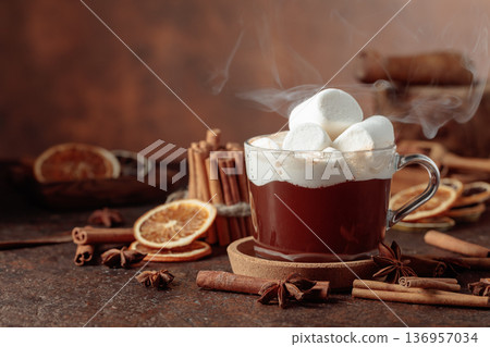 Hot chocolate with marshmallows on a dark brown background. Hot chocolate with marshmallows on a dark brown background. 136957034