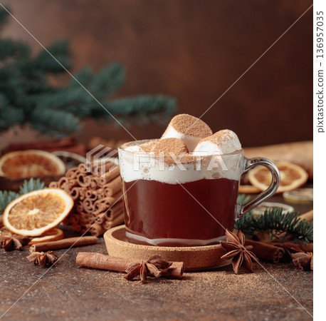 Hot chocolate with marshmallows sprinkled with cocoa powder. 136957035