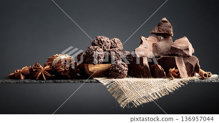Chocolate truffles with broken pieces of chocolate and spices. Chocolate truffles with broken pieces of chocolate and spices. 136957044