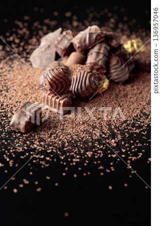 Chocolate candies sprinkled with chocolate chips. Chocolate candies sprinkled with chocolate chips. 136957046
