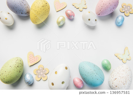Pastel easter eggs and spring decorations border 136957581