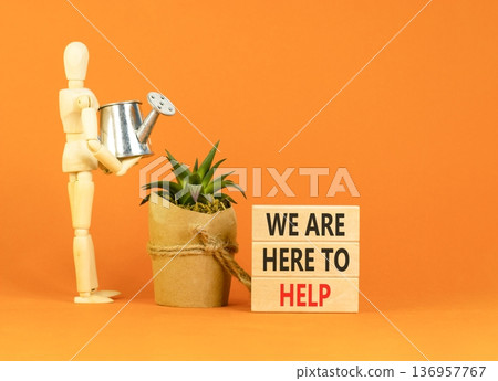 Support, help and we are here to help symbol. Concept words We are here to help on beautiful wooden blocks. Beautiful orange background. Business we are here to help concept. Copy space. Support, help and we are here to help symbol. Concept words We are here to help on beautiful wooden blocks. Beautiful orange background. Business we are here to help concept. Copy space. 136957767