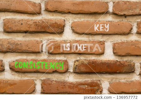 Consistency is the key symbol. Concept words Consistency is the key on beautiful brick wall. Beautiful brick wall background. Business consistency is the key concept. Copy space. 136957772