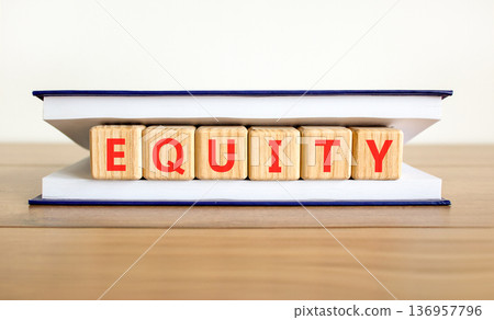 Equity support and help symbol. Concept word Equity on beautiful wooden blocks in beautiful book. Beautiful wooden table white background. Business equity support and help concept. Copy space. Equity support and help symbol. Concept word Equity on beautiful wooden blocks in beautiful book. Beautiful wooden table white background. Business equity support and help concept. Copy space. 136957796