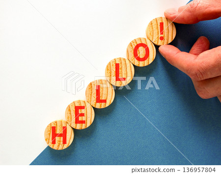 Hello welcome support and help symbol. Concept word Hello on beautiful wooden circles. Beautiful blue and white background. Business psychological hello support and help concept. Copy space. Hello welcome support and help symbol. Concept word Hello on beautiful wooden circles. Beautiful blue and white background. Business psychological hello support and help concept. Copy space. 136957804