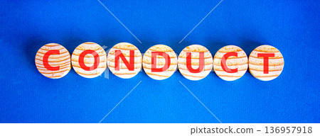 Conduct symbol. Concept word Conduct on beautiful wooden circles. Beautiful blue background. Business conduct concept. Copy space. Conduct symbol. Concept word Conduct on beautiful wooden circles. Beautiful blue background. Business conduct concept. Copy space. 136957918