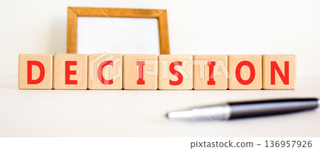 Decision word symbol. Concept word Decision on beautiful wooden blocks. Beautiful white background. Beautiful black pen. Business support help decision word concept. Copy space. Decision word symbol. Concept word Decision on beautiful wooden blocks. Beautiful white background. Beautiful black pen. Business support help decision word concept. Copy space. 136957926