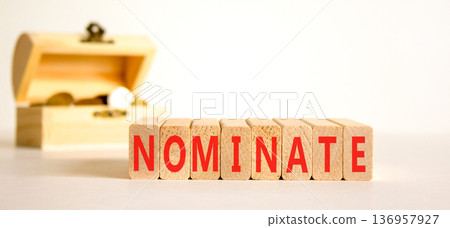 Nominate word symbol. Concept word Nominate on beautiful wooden blocks. Beautiful white background. Beautiful wooden chest with coins. Business support help nominate word concept. Copy space. Nominate word symbol. Concept word Nominate on beautiful wooden blocks. Beautiful white background. Beautiful wooden chest with coins. Business support help nominate word concept. Copy space. 136957927