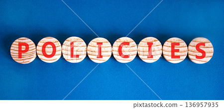 Policies word symbol. Concept word Policies on beautiful wooden circles. Beautiful blue background. Business support help policies word concept. Copy space. 136957935