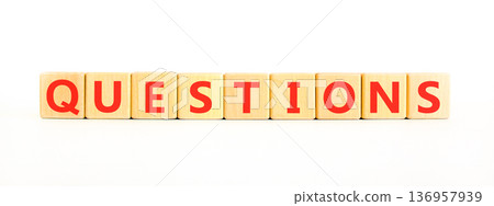 Question questions symbol. Concept word Questions on beautiful wooden blocks. Beautiful white background. Business education support questions concept. Copy space. Question questions symbol. Concept word Questions on beautiful wooden blocks. Beautiful white background. Business education support questions concept. Copy space. 136957939