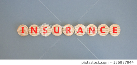 Insurance symbol. Concept words Insurance on beautiful wooden circles. Beautiful grey background. Business support medical insurance concept. Copy space. Insurance symbol. Concept words Insurance on beautiful wooden circles. Beautiful grey background. Business support medical insurance concept. Copy space. 136957944