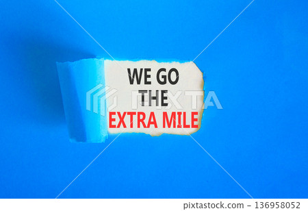 Support, help we go the extra mile symbol. Concept words We go the extra mile on beautiful white paper. Beautiful blue paper background. Business we go the extra mile concept. Copy space. Support, help we go the extra mile symbol. Concept words We go the extra mile on beautiful white paper. Beautiful blue paper background. Business we go the extra mile concept. Copy space. 136958052