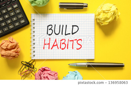 Build habits symbol. Concept word Build habits on beautiful white note. Black calculator. Black pen. Beautiful yellow paper background. Business build habits concept. Copy space. Build habits symbol. Concept word Build habits on beautiful white note. Black calculator. Black pen. Beautiful yellow paper background. Business build habits concept. Copy space. 136958063