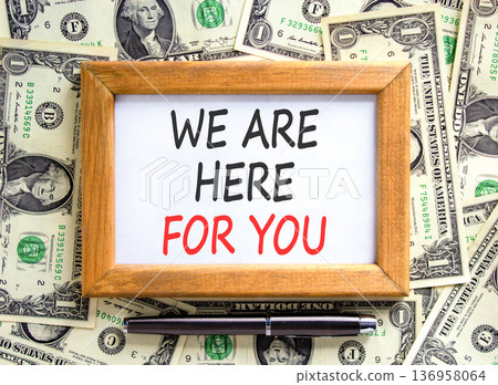 Support, help and we are here for you symbol. Concept words We are here for you on beautiful wooden picture frame. Beautiful dollar bills background. Business we are here for you concept. Copy space. Support, help and we are here for you symbol. Concept words We are here for you on beautiful wooden picture frame. Beautiful dollar bills background. Business we are here for you concept. Copy space. 136958064